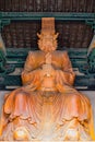 Wooden sculptured Buddhist Diety Royalty Free Stock Photo