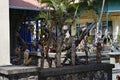 Wooden sculptures and masks in front of the Blue Penny Museum. The museum collection includes the 1847 Blue Penny and Red Penny st Royalty Free Stock Photo