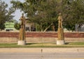 Wooden sculptures of 1890s-like railroad workers by chainsaw artist Clayton Coss at Norman Depot in Norman, Oklahoma.