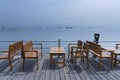 Wooden seat in empty beach cafe Royalty Free Stock Photo