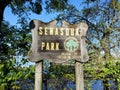 Wooden Senasqua Park sign in early morning spring sunlight