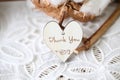 Wooden shaped heart with written words Love you on it, vintage font