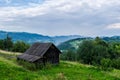 A wooden shed above a mountain valley Royalty Free Stock Photo