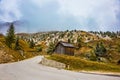 Wooden shed on the bend in the road Royalty Free Stock Photo