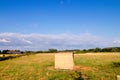 Wooden shed on farmland with blue sky Royalty Free Stock Photo