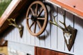 Wooden shed or hut with antlers and cart wheel decoration over doors Royalty Free Stock Photo