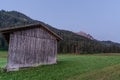 Wooden shed immersed in the mountain landscape Royalty Free Stock Photo