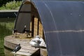 Wooden shed for sheltering birds in the water of a small lake Royalty Free Stock Photo