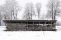 Wooden shed for storing logs, timbers and firewood Royalty Free Stock Photo