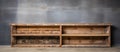 Wooden shelf against gray wall made of building material Royalty Free Stock Photo