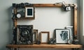 A wooden shelf with a collection of items on it, including a clock, a picture, and a picture frame. Royalty Free Stock Photo