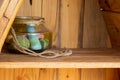 Decoration glass jar on wooden shelf