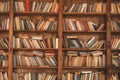 Wooden Shelf Filled With Books Is Presented In Library, With Front View And Blurred Image, Contributing To Historical Royalty Free Stock Photo