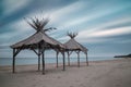 Wooden shelters on the beach Royalty Free Stock Photo