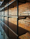 Wooden shelve and brick wall in the interior of a modern building Royalty Free Stock Photo
