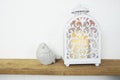 Wooden shelves decorated with White Lantern with Candle light and bird statue Royalty Free Stock Photo