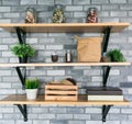 Wooden shelves with different home related objects.