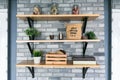 Wooden shelves with different home related objects.
