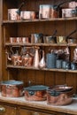 Wooden shelves full of pots and pans Royalty Free Stock Photo