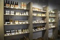 Wooden shelves in a shop full og jars and bottles with natural organic products
