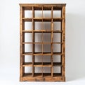 Rustic wooden shelving unit with a distinctive grid structure showcased on white background Royalty Free Stock Photo