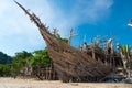 Wooden shipwreck with blue sky