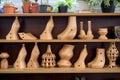 wooden shoe lasts in various sizes on shelf