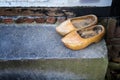 Wooden shoes in front of a doorstep