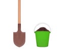 wooden shovel and green plastic bucket with soil isolated on white Royalty Free Stock Photo