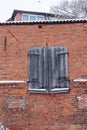 wooden shutters on the wall of an old East Prussian brick barn Royalty Free Stock Photo