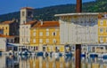 Wooden sign advertising laundry in Cres old town port Croatia