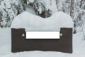 Wooden sign board, covered snow. Royalty Free Stock Photo