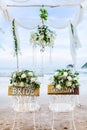 Wooden sign board decorate for Bride and Groom in Wedding Day with little flower for wedding ceremony at beach Royalty Free Stock Photo