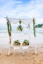 Wooden sign board decorate for Bride and Groom in Wedding Day with little flower for wedding ceremony at beach Royalty Free Stock Photo