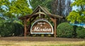 Wooden sign with welcome written on it. Sign welcoming drivers to the small community of Mission British Columbia Canada Royalty Free Stock Photo