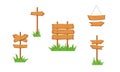 Wooden sign boards in the grass. Sign board on the stick, arrow signpost, showing direction. Old signboards for game. Blank banner Royalty Free Stock Photo