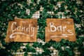 Wooden sign candy bar. Wedding pointer on wooden boards at wedding ceremony Royalty Free Stock Photo