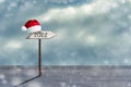 Wooden sign. 2022. Hat of Santa Claus. Snow. The concept of the right direction, in 2022. Copy space. Holidays. Business Royalty Free Stock Photo