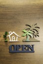 Wooden sign of House and Palm tree with Open sign Royalty Free Stock Photo