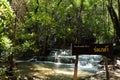 Wooden sign of Huay Mae Khamin waterfall, tier 7 Rom Klao, There are 7 floors in total. Royalty Free Stock Photo