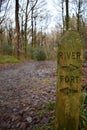 Wooden sign post indicating the directions to a river and a fort Royalty Free Stock Photo