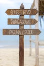 Wooden sign post to bungalows and the pool on beach, Peru Royalty Free Stock Photo