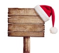 Wooden sign with red Santa's hat Royalty Free Stock Photo