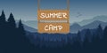 Wooden sign with summer camp typography at blue mountain and forest landscape Royalty Free Stock Photo