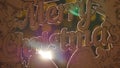 Wooden sign with text Merry christmas on the background of Christmas lights