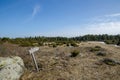 Wooden sign at a trail into wilderness Royalty Free Stock Photo