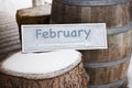 Wooden sign on tree stump with the word February Royalty Free Stock Photo