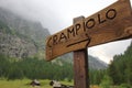 Wooden sign of village Crampiolo in Alpe Devero, Lepontine Alps, Ossola, Piedmont, Italy Royalty Free Stock Photo