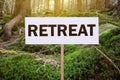 Wooden sign with word Retreat in beautiful forest Royalty Free Stock Photo