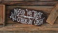 Wooden sign of "in god we trust, all others pay cash" Royalty Free Stock Photo